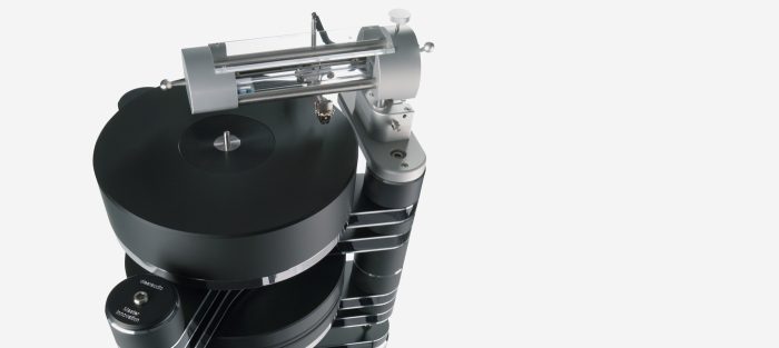 Clearaudio Master Innovation The latest model in the popular Innovation series shows clearly how even the best is constantly being further developed and brought to new sonic heights at Clearaudio. The 70mm-thick, dynamically balanced platter made of resonance damping plastic with a 15mm-thick precision-machined stainless steel sub platter delivers the highest mechanical standards. The Master Innovation doubles the inertia of the Innovation. Incredible rotational speed stability is achieved thanks to the combination of the patented Clearaudio ceramic magnetic bearing (CMB) supplemented by an additional flywheel and a high torque DC motor. An infrared sensor sends signals to an optical speed control mechanism to consistently maintain the perfect speed, while non-contact magnetic decoupling of the drive prevents any vibration or noise from the motor system from reaching the main turntable. Consequently, speed variations are eradicated and perfect pitch is obtained. The Master Innovation provides the ability to mount up to three tonearms. Existing Innovation owners have the option to upgrade to Master Innovation level.