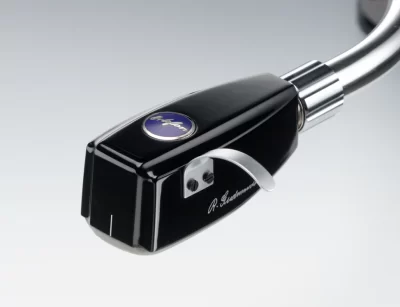 The Ortofon SPU Meister Silver G MkII has been improved on coil winding material, stylus, and magnet. The masterpiece of Mr. Robert Gudmandsen, the SPU Meister Silver was introduced in 1996 as a technological improvement of great importance. Ortofon has succeeded in having the purest silver wire ever produced for the coil winding process. 