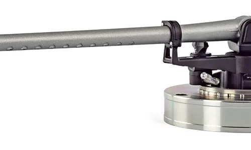 MICHELL TecnoArm 2 The TecnoArm 2 is designed to offer a truly audiophile listening experience at exceptional value for money and easily competes with tonearms at three times the price! Utilising a custom one piece arm tube, the tube is first shot - blasted to change the sonority (ringing tone) of the tube, we then drill 22 holes in the tubes underside to reduce it's mass. The underside of the integral head shell is machined to be perfectly parallel with the bearing position. The tonearm is then assembled using the new ultra-low friction polymer bearings and mounted on a redesigned mounting base. The TecnoArm 2 is wired with our proprietary wiring loom and 99.9999% pure silver litz wire, from cartridge tags to phono plugs, with no internal wiring joints. Image shows the tonearm mounted to an arm plate, arm plate is not included. Our TecnoWeight counter weight allows you to set the tracking force for your chosen cartridge easily and our new VTA/SRA adjuster sets the height of your tonearm, helping you ensure the stylus tracks the vinyl groove at the correct angle. The TecnoArm 2 has been designed to offer a truly audiophile listening experience with exceptional value for money. This is a tonearm that can easily compete with others three times the price!
