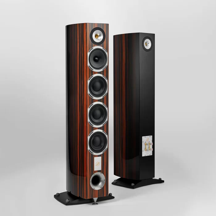 Triangle Magellan - Quatuor 40th Premium Floorstanding Speaker - Magellan Quatuor 40th Music as if you were at the opera. The sound image takes on a whole new dimension here, filling the space with sophistication. The Quatuor 40th, a 135cm high 3-way floorstander, is the flagship of the new MAGELLAN 40th anniversary edition. With a new dome made of magnesium alloy, its horn tweeter reveals the finest details of your recordings smoothly and accurately. The Quatuor 40th is characterized by the addition of a rear tweeter that allows the speaker to radiate energy to the front and rear of the transmitting point. The sound level is better distributed, and the placement of the speaker simplified. The 16cm driver with a paper diaphragm and small pleat suspensions, a distinctive feature of TRIANGLE speakers, reproduces any vocal register with great neutrality and without the slightest coloration. The powerful and extensive bass of the three 16cm drivers is perfectly suited for modern music as well as for a prestigious string quartet or a cello suite. Its proprietary SVA diaphragm and its cooling system provide exceptional performances in the bass and sub-bass register. Its extended bandwidth and its significant reserve of power make it possible to easily provide sound in rooms larger than 30m2.