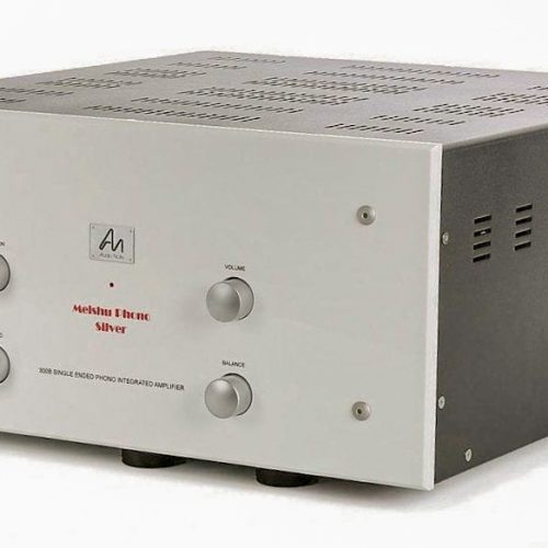 Audio Note Meishu Tonmeister Line S.E As with what we learned developing the 211 amplifiers, each element in a circuit is like each lens in a microscope, and has to be perfectly chosen and formed to correctly work with the proceeding and following lenses (or stages in the amplifier circuit). If the lenses in a microscope are not correctly chosen and adjusted, the image becomes blurred, and detail and information is lost. The same is true for an amplifier circuit; if each stage is not absolutely correctly chosen and matched to work optimally with the rest of the amplifier, the result will be blurred, unfocused, uneven sound lacking in information. So to create a better amplifier, the natural idea was to simplify the circuit and optimise every element, so the combination works seamlessly and harmoniously together. This is exactly what we have done with the MEISHU Tonmeister. The new PSU uses only one mains transformer, one 5U4 rectifier valve and one choke. When this arrangement is optimised, it works extremely well, producing a very homogeneous and ‘complete’ sound. The input and driver stage is very similar to that found in the JINRO, TOMEI and ONGAKU, with a 12AU7 and 5687 driving an in-house designed and manufactured inter-stage transformer for the best energy transfer, evenness and authority. This is the most important, fundamental upgrade over the original design. The output transformers for the new MEISHU were designed specifically for the project by Andy Grove, and it is not an overstatement to say that they are superb. The circuit is now a beautiful example of elegant simplification, something that could only be realised thanks to our ability to create extremely closely matched transformers in-house, and having our own supply of custom resistors, in-house made foil capacitors and custom made electrolytic capacitors. These allow us to exert extremely tight control over the performance and voicing of the complete amplifier from input to output, something that is simply beyond the possibilities of manufacturers who have to rely on 'off the shelf' components. The result is an amplifier that maintains the legendary Audio Note musicality, midrange magic and glorious tonal colour of the original MEISHU, whilst bringing new and previously unheard levels of information retrieval and dynamic expression, redefining what is usually expected of a 300B SET amplifier.
