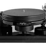 Nottingham Analogue Spacedeck One of Nottingham Analogue's most popular turntables. The 37mm platter is mounted onto its own chassis and runs on their classic bronze bearing. The motor/pulley assembly is mounted in its own housing which sits separately from the turntable chassis, the only connection is the drive belt. This helps to avoid audio resonances being transferred through the chassis of the turntable.