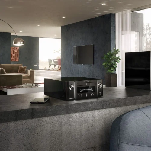 Marantz MELODY X All the Marantz benefits in one unit. The M-CR 612 is designed for those spaces that require a lot of Marantz features all in one unit. A rich sound combined with a wide range of source options make it an excellent Marantz system. Marantz presents the Melody X, a stylish hi-fi system that features a CD player, FM/DAB+ radio, network connectivity, voice control and multiroom capability thanks to built-in HEOS technology. • Minimal Design and Size • Supports CD & CD-R/RW • Exclusive HDAM circuitry • Built-in HEOS All you need for the M-CR612 system is a pair of speakers. Its player plays CD and WMA / MP3 (CD-R /RW) discs, while the receiver has FM / AM. Network-wise the device supports TuneIn, Internet Radio, Spotify, Amazon Prime Music, TIDAL, Deezer and via smartphone AirPlay 2 and Bluetooth. Also Amazon Alexa, Google Assistant and Apple Siri. Supports WAV / FLAC / ALAC 192KHz/24-bit, DSD 2.8 / 5.6 MHz. It has built-in Bluetooth, dual-band Wi-Fi and two optical digital inputs. The panel has an OLED display that shows numbers and text.