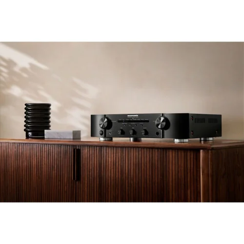 The PM6007 integrated amplifier delivers a realistic listening experience and rich, full Marantz sound. With cutting-edge technologies, it is the choice for those ready to upgrade their two-channel Hi-Fi system. It features an upgraded, high-quality DAC, digital inputs and a newly updated built-in phono equalizer. Slim Design 2.2 Channels 45 Watts per channel Specially Designed HDAM Your next step in Marantz high fidelity It features an upgraded, high-quality AK4490 DAC, digital inputs and a newly updated and built-in phono. Enjoy high-resolution audio files exactly as intended via the following gold-plated inputs: 5 analog inputs, one coaxial input and two optical digital inputs. Integrated Amplifier The amplifier's current feedback technology delivers a wide frequency range and high-speed audio reproduction. Combined with the high power handling, the PM6007 amplifier has a large power reserve to easily drive even the most demanding speakers. Advanced thermal management prevents signal distortion for clean amplification under any conditions. Reference-Quality D/A Converter for Digital Input The PM6007 amplifier features a new high-resolution D/A converter for a richer audio experience. It is equipped with a reference-class D/A converter, which provides resolution up to 192 kHz/24 bit for optimal fidelity with high-resolution music files. High-Power Power Supply The power supply supports fast-speed Schottky Barrier diodes and large-capacity capacitors fed by a toroidal transformer, and together provide a wide dynamic range and low-interference output driving.