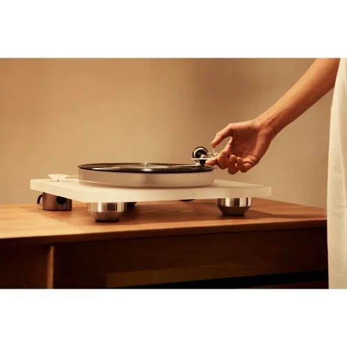 Marantz TT-15S1 Turntable Defined by its transparent sound, impeccable detail and superior quality cartridge, the TT-15S1 reproduces impeccable high fidelity. • Manual Operation • Belt Drive • Isolated Motor • Low Resonance • Clearaudio Virtuoso MM Cartridge Incredible Materials and Incredible Sound Masterfully crafted and carefully crafted with exquisitely selected materials, the TT-15S1 is as impeccable as it gets, delivering the most authentic form with unprecedented clarity. Designed for Performance The TT-1551 is more than incredible: it has been expertly engineered to provide the perfect platform for your records to sound their best. This includes a low-resonance high-density acrylic chassis and platter. Sound Master Tuned Marantz's international team of Sound Masters have meticulously tuned the TT-15S1 for outstanding performance with carefully selected components to create the most musical sound in your home. Belt Drive System The TT-1551's belt drive system features an endless silicone belt for the smoothest possible turntable rotation, ensuring precise timing and an immersive listening experience. Asynchronous Motor Endless silicone belt drive Acrylic chassis Anodized Tonearm 3cm thick acrylic platter Ceramic platter mount Micro-adjustable counterweight Marantz-made Clear Audio Symphonie cartridge in ebony body Magnetic anti-skating system Smart record retention system