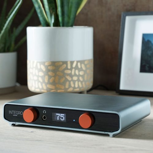 Volumio Integro The Integrated Network Amplifier The Volumio Integro is a compact, all-in-one (amplifier + streamer) audio solution combining a powerful amplifier with advanced network streaming capabilities. This integrated network amplifier combines direct-digital dual mono Class-D technology in a sleek, compact design. With Volumio Premium features provide a HiFi system that streams music from services like Spotify, Tidal, and Qobuz, all controlled through a single app. It also has seamless Roon Integration through the custom made Volumio OS! Crafted in Italy, the Integro offers audiophile-grade sound quality, seamless connectivity, and user-friendly setup, making it a standout choice for music enthusiasts. Volumio Integro – The Integrated Network Amplifier The Integrated Network Amplifier with direct-digital dual mono Class-D amplifier technology, enclosed in a stylish compact design. Includes all Volumio Premium features. ALL-IN-ONE STREAMER INTEGRO is a plug & play device. Once you connect your speakers, you have a complete hi-fi system. No extra equipment required. CONNECT YOUR MUSIC IN ONE APP INTEGRO lets you stream from your favorite music services such as Spotify, Tidal and Qobuz. DEDICATED SUPPORT One-on-one support to help with everything from set-up to troubleshooting. Always available for you! THE BEST SOUND DIRECTLY TO YOUR SPEAKERS INTEGRO is ready to plug & play device, just connect your speakers to it and you have a complete HiFi system to enjoy your music to the fullest. No need for extra equipment, all of the components necessary come in a compact design, giving you the possibility to put the Integro in any place you want. ENJOY MUSIC FROM YOUR FAVORITE SOURCES Integro lets you stream from your favorite music services Bring your content from local or network-attached drives and play internet radio. Integro lets you stream from your favorite music services such as Spotify, Tidal and Qobuz. Volumio plugins allow you to connect to many additional services and functionalities such as Youtube, Soundcloud, Radio Paradise, FusionDSP and more. Bring your content from local or network-attached drives and play internet radio all thanks to Volumio OS. EASY SETUP Getting started just takes a couple of minutes with the Volumio official iOS and Android apps MADE IN ITALY All Volumio products are proudly designed and assembled in Florence Italy OON READY All Volumio products are Roon Ready certified by Roon Labs. This allows seamless integration with Roon system and guarantees the use of Roon streaming technology with Volumio Integro, without compromising high audio performance. A LOOK TO BE SEEN AND FELT Every aspect of the Integro was carefully designed with the collaboration of the Red Dot Award winner Design Narratives. In addition to the compact design, the electronics that give Integro its musicality are covered in a chassis of antimagnetic aluminum, with two orange knobs to control volume and inputs options, accompanied by an OLED display. IMMERSIVE SOUND: INTEGRO PLUGGED IN INTEGRO has one of the world’s best-sounding headphone amplifiers you can use for your intimate listening and merry them to a specially tuned dual-mono Class-D amplifier design, powered by MA12070P from Infineon. From whichever source you are playing your music, Integro brings out the most wonderful details to life. YOUR MUSIC SOUNDS AS IT SHOULD INTEGRO has one of the world’s best-sounding headphone amplifiers you can use for your intimate listening and merry them to a specially tuned dual-mono Class-D amplifier design, powered by MA12070P from Infineon. From whichever source you are playing your music, Integro brings out the most wonderful details to life. ALL THE CONNECTIONS YOU NEED Integro has one single-ended analog input (RCA) and two digital SPDIF both optical and coaxial. In terms of outputs there is a subwoofer out, and the HDMI out can be used to take advantage of the OSD menu of Volumio. VOLUMIO PREMIUM BUILT IN On board, the Integro is the latest version of Volumio – Volumio AI- that incorporates Supersearch an AI-powered search function that is meant to optimize your music discovery. Volumio OS comes with a Multi-room capability that creates an integrated environment with other Volumio stations in your home.