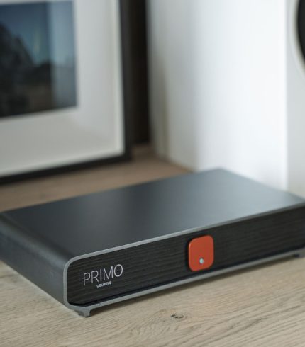 Volumio Primo The Music Network Player and Streamer with a high-level DAC that brings you to the world of streaming without any compromise. Includes all Volumio Premium features. Made with SABRE DACs connected in I2S to the digital input section, that can satisfy any enthusiast entering the world of streamers. PRIMO lets you stream from your favorite music services such as Spotify, Tidal and Qobuz. One-on-one support to help with everything from set-up to troubleshooting. Always available for you! A COMPLETE REDESIGN. Designed by the latest Red Dot Award winner, Design Narratives Ltd. has designed the Primo around a chassis made of antimagnetic aluminum. Complementing with a dark wood texture front panel and adding a status LED and power button, giving a 360˚ aesthetic change from our first version of Primo. ENJOY MUSIC FROM YOUR FAVORITE SOURCES Primo lets you stream from your favorite music services Bring your content from local or network-attached drives and play internet radio A BUILT IN TOP OF THE LINE DAC TO BRING HI-FI SOUND A truly complete product, for those who already have an audio system and want to complete it with a high-level DAC-Streamer. Volumio Primo was made with the top of the SABRE DACs -the ESS 9038Q2M– in differential configuration connected in I2S to the digital input section, that can bring any enthusiast to the world of streamers without compromising. POWER COMES FROM WITHIN With all internal components carefully being examined for improvements, Primo was developed with a highly performant quad-core processor, making Primo achieve first-class efficiency and speed for audio reproduction. The latest Amlogic Quadcore CPU running at 1.9GHz and 2GB of RAM form Primo brain that effortlessly runs the Volumio OS. GET WELL CONNECTED Explore a wide range of connectivity options with Primo. Analogue audio outputs are available in both balanced and single-ended formats, and there’s a digital SPDIF coaxial output, one HDMI port for an external monitor and two USB ports. VOLUMIO PREMIUM BUILT IN On board, the Primo is the latest version of Volumio – Volumio AI- that incorporates Supersearch an AI-powered search function that is meant to optimize your music discovery. Volumio OS comes with a Multi-room capability that creates an integrated environment with other Volumio stations in your home.