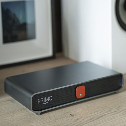 Volumio Primo The Music Network Player and Streamer with a high-level DAC that brings you to the world of streaming without any compromise. Includes all Volumio Premium features. Made with SABRE DACs connected in I2S to the digital input section, that can satisfy any enthusiast entering the world of streamers. PRIMO lets you stream from your favorite music services such as Spotify, Tidal and Qobuz. One-on-one support to help with everything from set-up to troubleshooting. Always available for you! A COMPLETE REDESIGN. Designed by the latest Red Dot Award winner, Design Narratives Ltd. has designed the Primo around a chassis made of antimagnetic aluminum. Complementing with a dark wood texture front panel and adding a status LED and power button, giving a 360˚ aesthetic change from our first version of Primo. ENJOY MUSIC FROM YOUR FAVORITE SOURCES Primo lets you stream from your favorite music services Bring your content from local or network-attached drives and play internet radio A BUILT IN TOP OF THE LINE DAC TO BRING HI-FI SOUND A truly complete product, for those who already have an audio system and want to complete it with a high-level DAC-Streamer. Volumio Primo was made with the top of the SABRE DACs -the ESS 9038Q2M– in differential configuration connected in I2S to the digital input section, that can bring any enthusiast to the world of streamers without compromising. POWER COMES FROM WITHIN With all internal components carefully being examined for improvements, Primo was developed with a highly performant quad-core processor, making Primo achieve first-class efficiency and speed for audio reproduction. The latest Amlogic Quadcore CPU running at 1.9GHz and 2GB of RAM form Primo brain that effortlessly runs the Volumio OS. GET WELL CONNECTED Explore a wide range of connectivity options with Primo. Analogue audio outputs are available in both balanced and single-ended formats, and there’s a digital SPDIF coaxial output, one HDMI port for an external monitor and two USB ports. VOLUMIO PREMIUM BUILT IN On board, the Primo is the latest version of Volumio – Volumio AI- that incorporates Supersearch an AI-powered search function that is meant to optimize your music discovery. Volumio OS comes with a Multi-room capability that creates an integrated environment with other Volumio stations in your home.