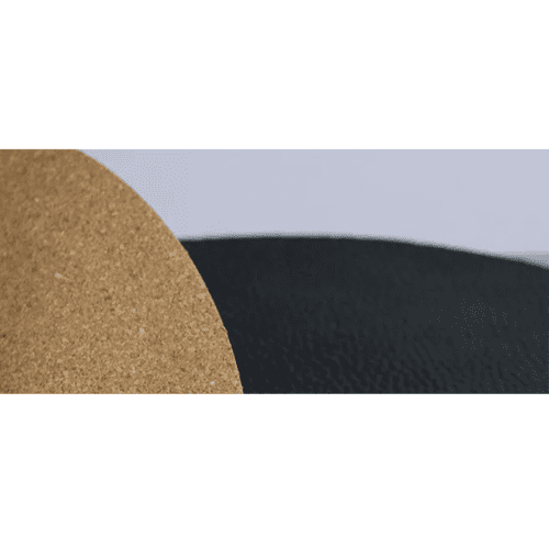 LUDIC turntable mat διπλής όψης LUDIC Double sided Genuine Leather & Cork The Double side Leather & Cork Mat is a premium mat made from Genuine leather and cork. This will give the best acoustic feedback when playing records which is one of the major problems when playing records. The cause is the sound that has just been produced by the speakers which comes back to the record player and cause it to vibrate. The problems is that there is a very slight time difference between the reproduced sound and the sound that is fed back onto the record player. This results in a big loss of detail and clarity and makes the sound “muddy”. So every effort has to be done to isolate the record player from its surroundings as well as to isolate the record from the record player. With the goal to reduce acoustic feedback from the surroundings back to the record and the cartridge a lot of effort has gone into developing turntable mats that make the reproduced sound crystal clear with great separation and detail. There are different materials to achieve this, the leather&cork mat is one of the best options and still for a very good price.