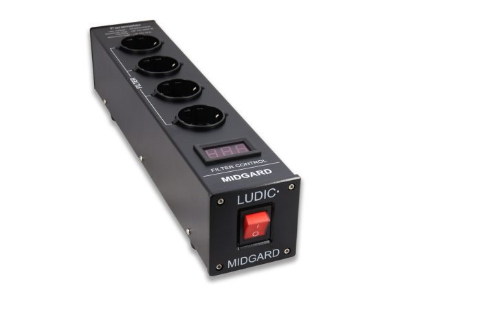 LUDIC Midgard Power netfilter Aluminium Ludic welcomes another power filter to the Ludic Power Filter Series family, we call it the Midgard and is your key to a clean grid, and can generate smooth voltage and current. A clean and efficient power system normally generates a stable current waveform, but the modern electric equipment used in today’s equipment benefits us with greater convenience as well as cost savings from higher production efficiency, but this generates also some power problems, think not only about your audio equipment but also computers, led lights and more..in your house, all connected on the same group. However, this can also bring significant wave currents and unbalanced loads, distortion, reactive power impact, that tend to cause power quality problems in our home power systems, Ludic Midgard gives you the power improvement, with filter noise reduction , leakage Protection, and lightning protection, and It also adopts an overload protection, the Ludic Midgard is a great solution to get rid off harmonic distortion, voltage and current distortion. The Midgard is compact in design, durable and provides a flexible installation method for users to efficiently manage their space, we use therefore 4 power sockets in Midgard, the power filter is also mounted with an easy to read red-color display to monitor the current load on the Midgard. Midgard use a big on/off led power button that is easy to use with big or small fingers for an instant on/off solution. Improve your power quality at home with the Ludic Midgard Power Filter.