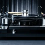 J.Sikora Turntables - Initial MAX Hi End turntable from J.Sikora, the Initial Line MAX is the company's introductory model but here in the MAX version with all possible upgrades incorporated, with total weight [kg]: 51, platter weight [kg]: 4, platter material: Delrin®, made of aluminum, inox and cast iron. Bearing type: ceramic ball - inverted, with 2 DC motors, rubber belt, possibility for 2 arms, arm board, Clamp, glass mat, external power supply available in silver or black.