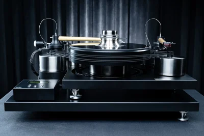 J.Sikora Turntables - Initial MAXHi End turntable from J.Sikora, the Initial Line MAX is the company's introductory model but here in the MAX version with all possible upgrades incorporated, with total weight [kg]: 51, platter weight [kg]: 4, platter material: Delrin®, made of aluminum, inox and cast iron. Bearing type: ceramic ball - inverted, with 2 DC motors, rubber belt, possibility for 2 arms, arm board, Clamp, glass mat, external power supply available in silver or black.
