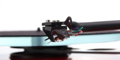 REGA AniaREGA Ania

Welcome to the world of moving coils
Rega’s Moving Coil cartridge design is unique in its approach to achieving an ultra-low mass generator which is undamped (no tie wire) using a unique rhomboid pivot for the cantilever powered by a purpose designed, exclusive to Rega, Neodymium magnet system. This type of design requires a zero-tolerance engineered cartridge body which is Rega’s area of expertise and with the Apheta 3 and Aphelion 2 products these bodies are machined from one piece of the highest quality aluminium. This is a difficult and expensive process requiring all of Rega’s years of experience to achieve. In particular, the “zero” tolerancing of the body is required in the alignment and dimension of the pivot pad mounting hole and the magnet mechanism mounting hole relationship.