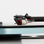 REGA Nd3 The all new Nd3 moving magnet cartridge was developed over 10 years and promises to deliver ‘next level’ performance from moving magnet technology. The Nd range (patent pending) we believe is a world first to use ultra-high powered Neodymium magnets which allow us to create this totally unique design. Advanced Technology Each Nd3 is meticulously hand-made by our highly skilled technicians. The stylus profile is a high quality elliptical profile manmade polycrystalline diamond, which is bonded to a round titanium shank. The design uses brand new generator geometry with perfect symmetry to achieve accurate channel balance. The Nd3 also has an optimised pole gap for superior linearity and cross talk characteristics, this provides a far wider soundstage than the previous models. This new cartridge is created with miniaturised parallel coils which are wound in house utilising 38-micron wire with just 1275 turns. This produces a low inductance, low impedance generator giving vastly improved high frequency response. In keeping with our commitment to sustainability, the Nd range is supplied in 100% recyclable packaging.