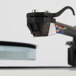 REGA Nd5 The all new Nd5 moving magnet cartridge was developed over 10 years and promises to deliver ‘next level’ performance from moving magnet technology. The Nd range (patent pending) is a world first to use an ultra-high powered Neodymium magnet which allow us to create this totally unique design. Advanced Moving Magnet Each Nd5 is meticulously hand-made by our highly skilled technicians. The stylus profile is a perfect elliptical nude diamond. This is a true ellipse created by an elliptical grinding process made from polycrystalline manmade diamond. The design uses brand new generator geometry with perfect symmetry to achieve accurate channel balance. The Nd5 also has an optimised pole gap for superior linearity and cross talk characteristics. This provides a far wider soundstage than the previous models. This new cartridge is created with miniaturised parallel coils which are wound in house utilising 38-micron wire with just 1275 turns. This produces a low inductance, low impedance generator giving vastly improved high frequency response. In keeping with our commitment to sustainability, the Nd range is supplied in 100% recyclable packaging.