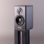 Magico A1 The A1 bookshelf loudspeaker features a fully braced aluminum enclosure, beryllium dome tweeter, carbon Nanographene cone, and our renowned elliptical crossover. Enclosure The A1 enclosure is constructed using 3⁄8” thick 6061 T6 aircraft grade aluminum, similar to the enclosure developed for the Q1 and is available in an elegant brushed-aluminum, black anodized finish. An innovative internal bracing technique along with the most advanced damping materials makes the sealed enclosure incredibly rigid and free of unwanted mechanical resonances. The complete enclosure design of the A1 is evaluated in simulation using the latest FEA software along with physical testing to meet the uncompromising requirements of Magico for optimized enclosure rigidity, stability and to ensure benchmark acoustical standards.